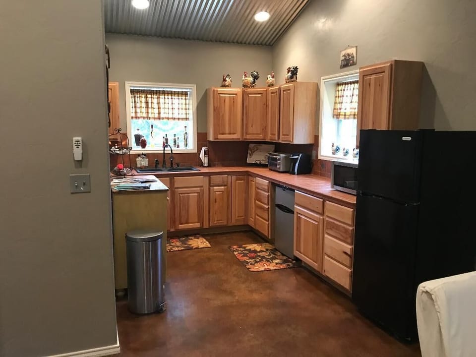 Kitchenette includes toaster oven, microwave, fridge, and Keurig coffee maker