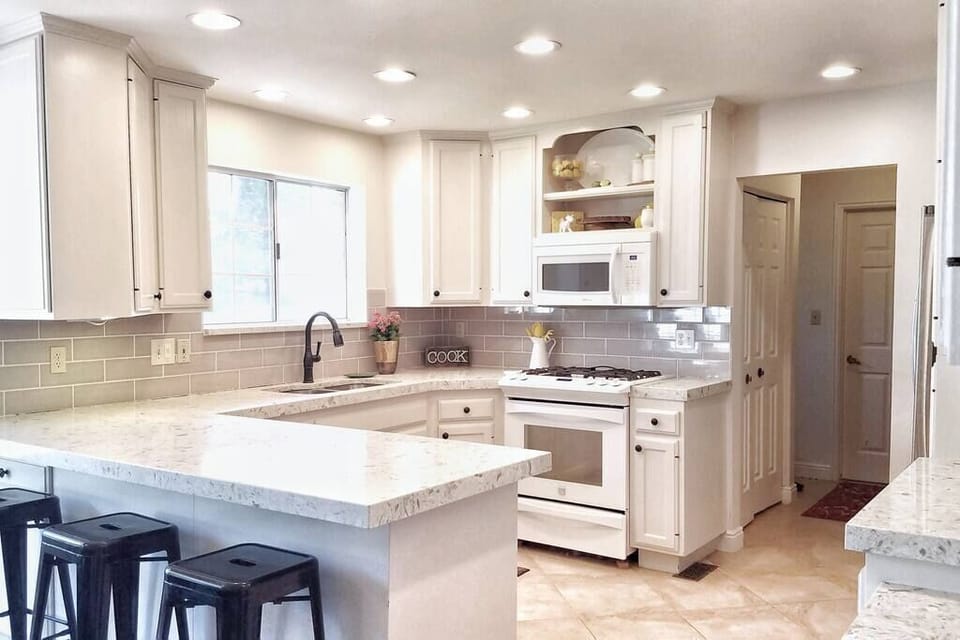 The kitchen provides all necessities including a coffeemaker, kitchen utensils, bakeware, wine glasses, spices, and other essentials to cook a fantastic meal. The table comfortably seats 8 with more seating provided upon request.