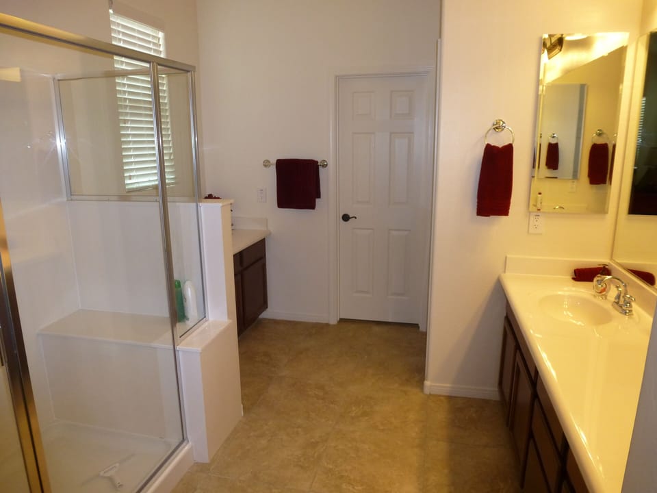 Double sink master bathroom, with large shower and private toilet.  