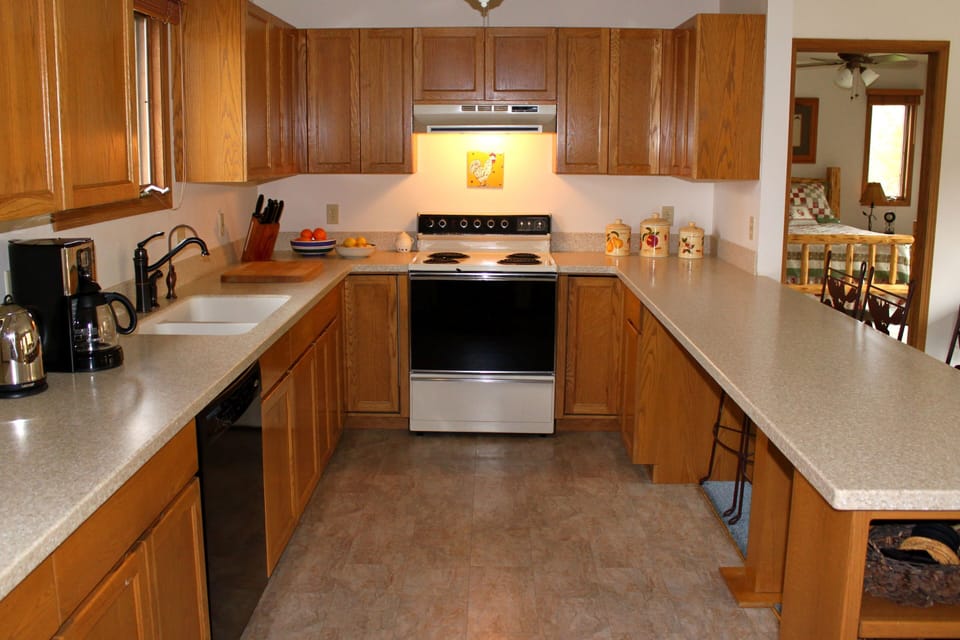 Large, well-equipped kitchen with new floors & new countertops