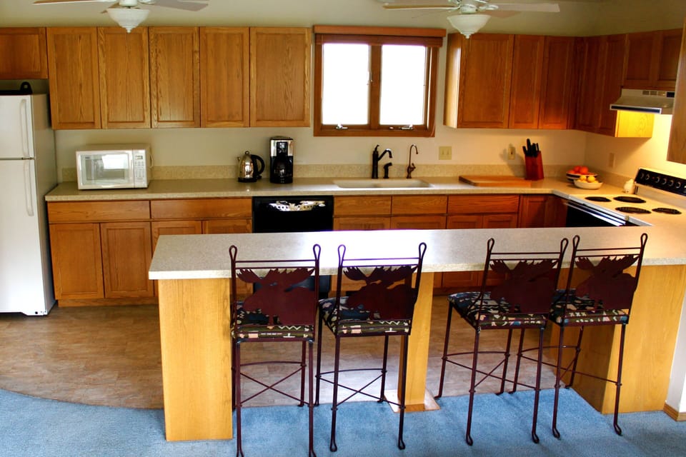 Kitchen includes breakfast bar and view of the Crazy Mountains from window