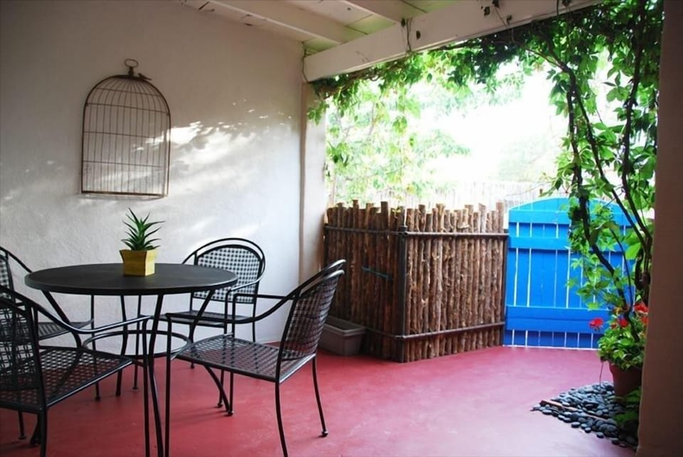 Covered front porch for outdoor dining and relaxation.