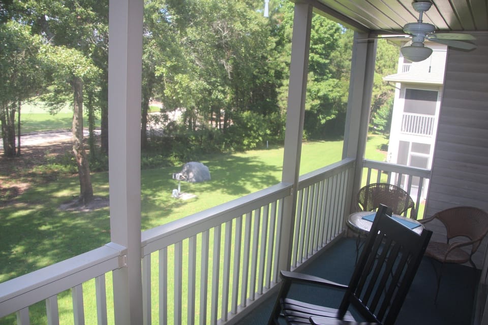 Verandah with view of barbeque in grassed area