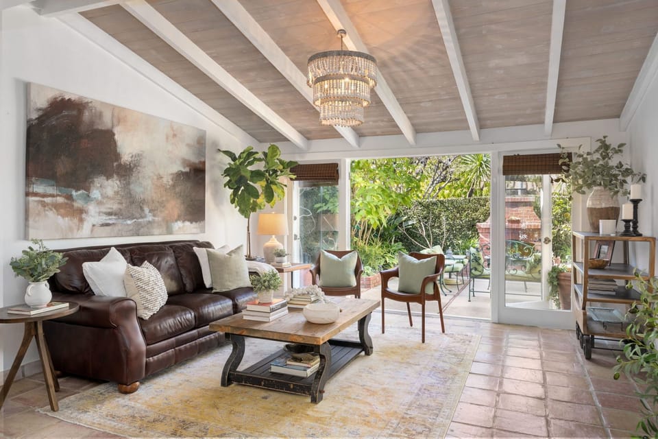 Doors open up to enclosed backyard for enjoying the cool breezes