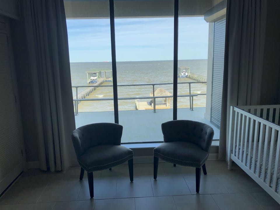 Master bedroom sitting area with bay views
