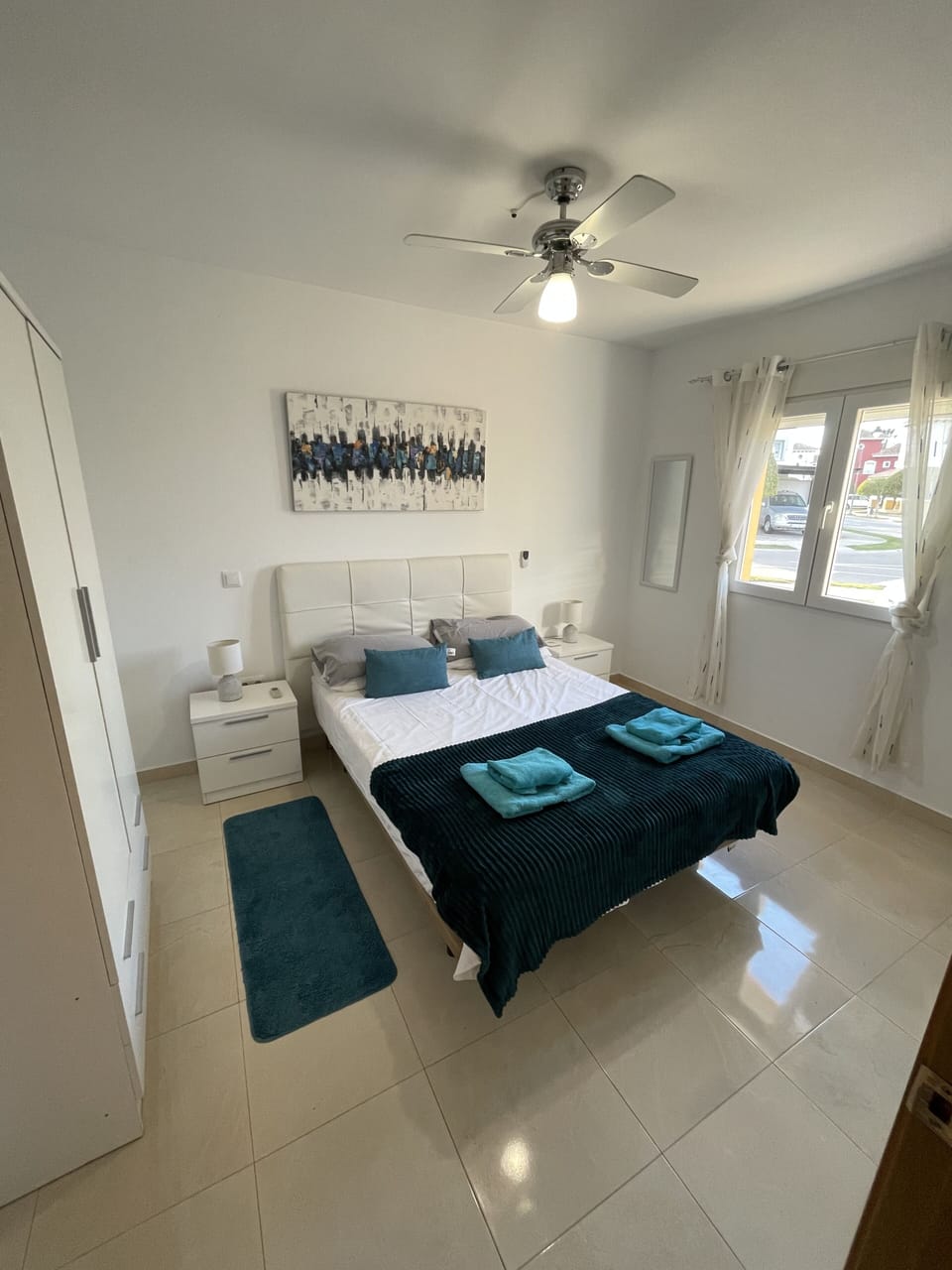 Bedroom 2 located downstairs with access to adjacent bathroom with shower 