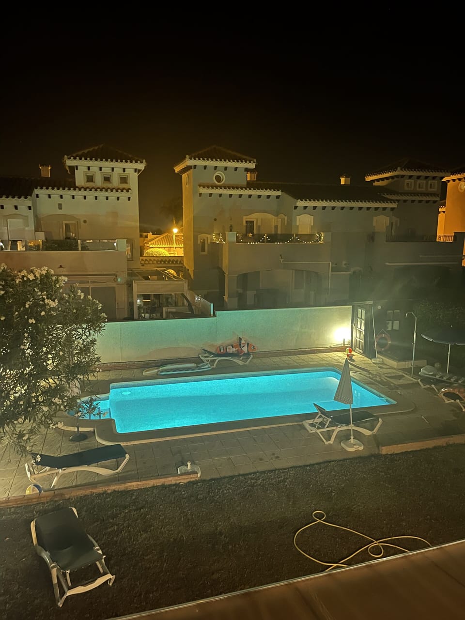 Nigh-time view of pool from balcony on the Master bedroom. 