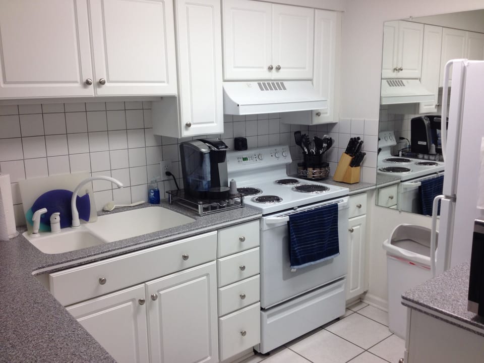 Kitchen with Corian countertops.