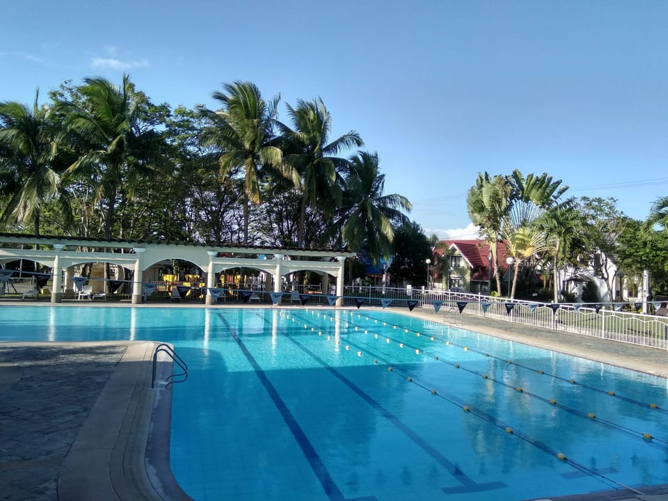 Olympic size swimming pool. To the left is another small pool for children.