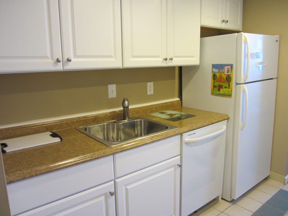Updated cabinets, counters, dishes, sink, and dishwasher here.