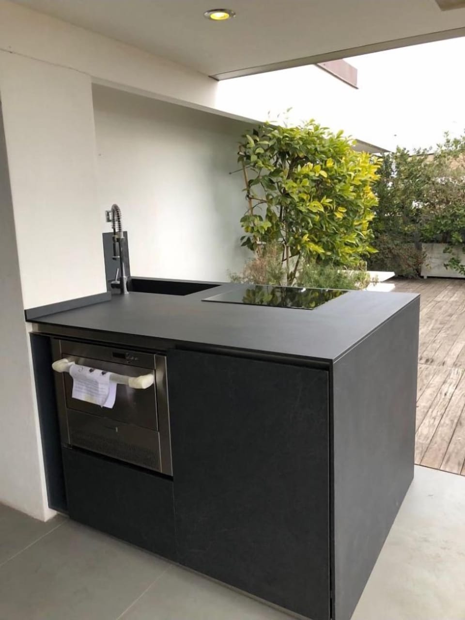 outdoor kitchen with fridge and ice maker