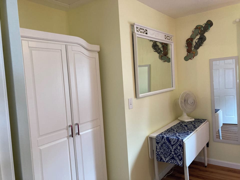 Master bedroom- table for luggage and closet