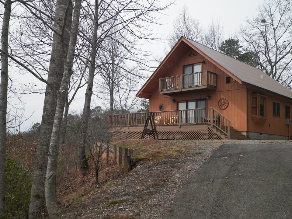 Paved driveway; Wrap-around deck & balconies to enjoy view; 2-wheel drive access