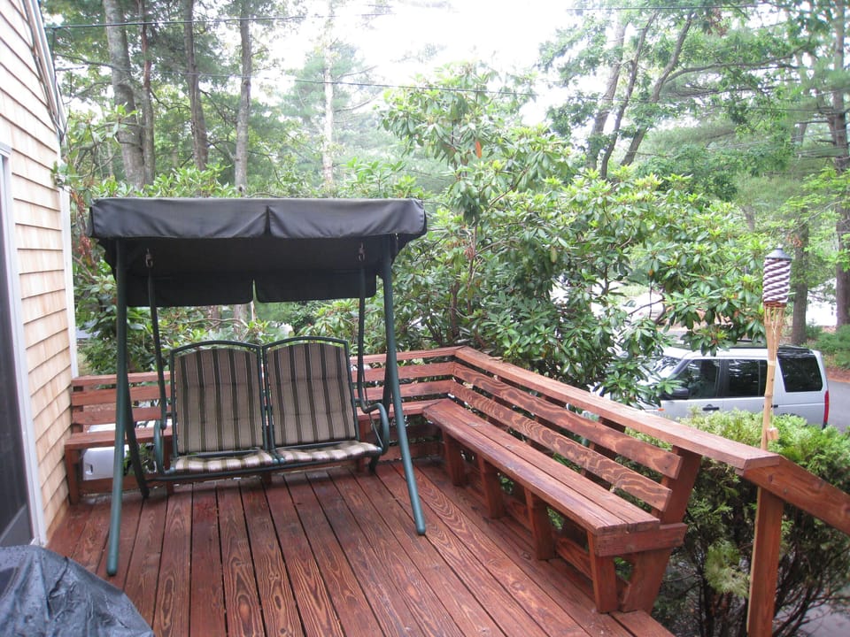 front deck with grill. Two driveways -  one on each side of house.