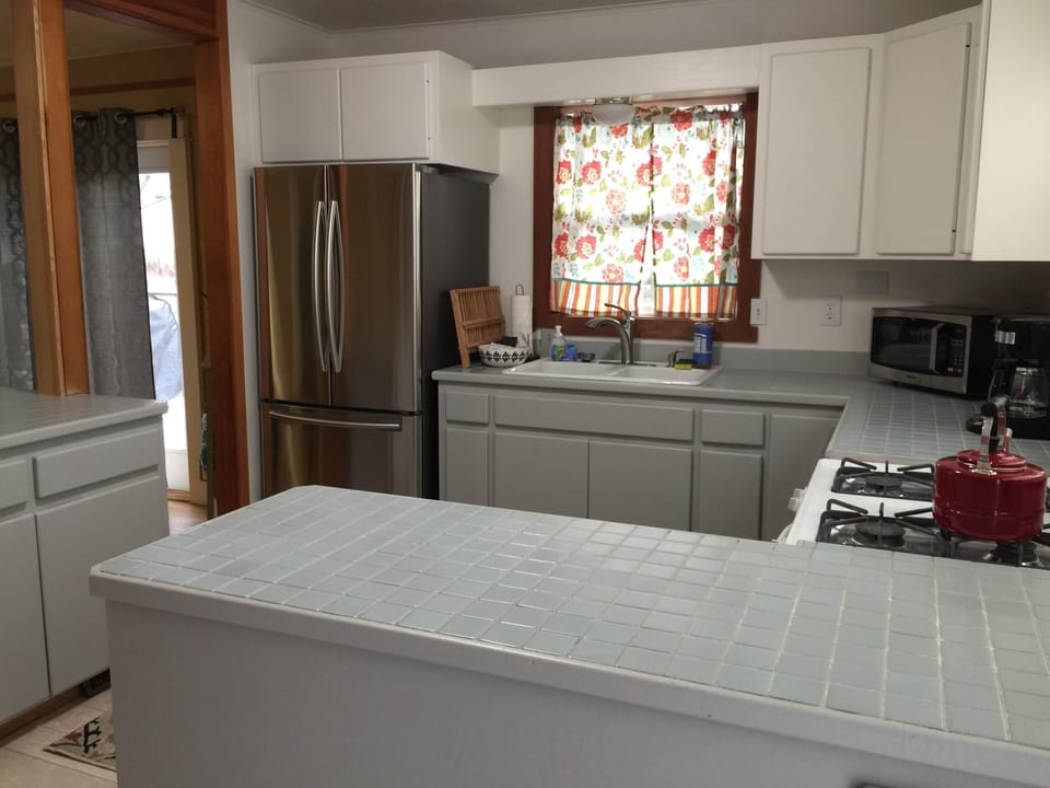 New stainless refrigerator, dishwasher and microwave