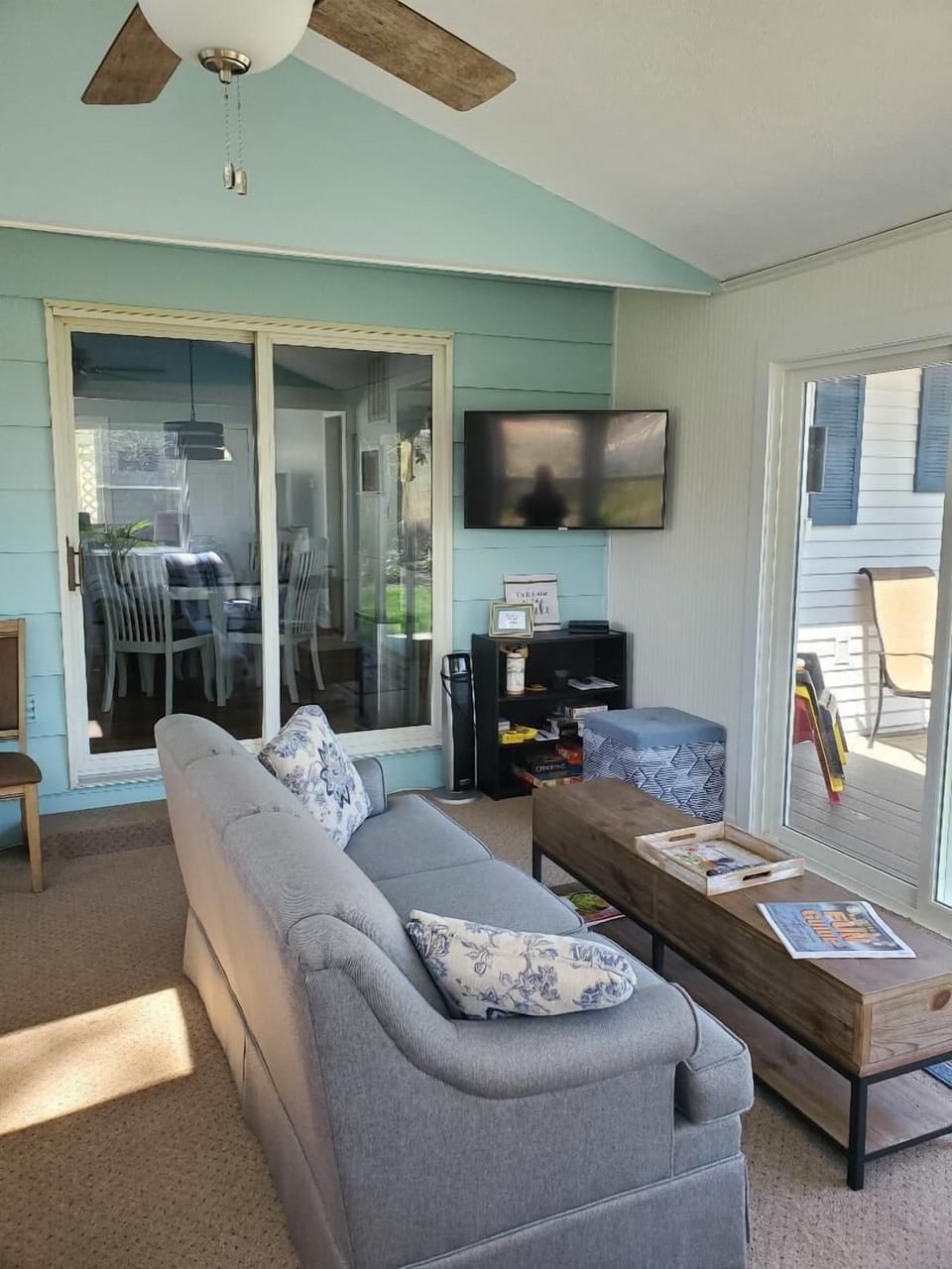 Additional living space in the sun room with lake views.
