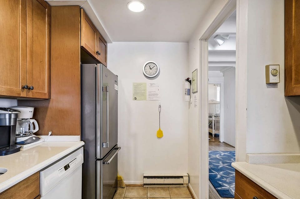 Kitchen area with stove, refrigerator, microwave, dishwasher, etc.