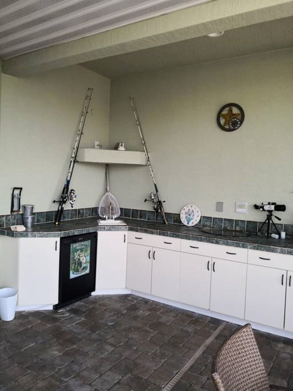 outdoor kitchen with bar fridge