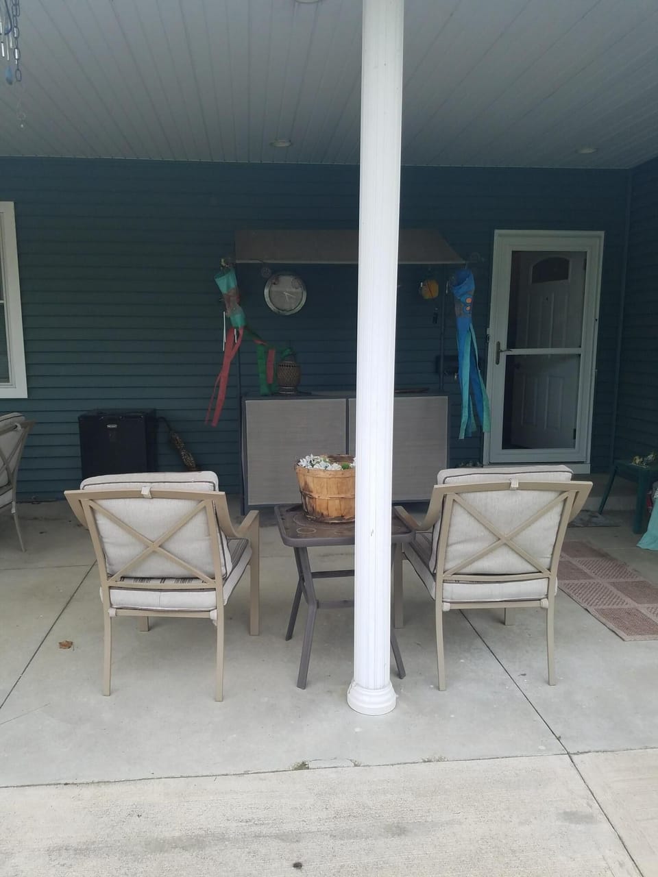 Entry has steel door and storm door with screen to let in the breeze.
