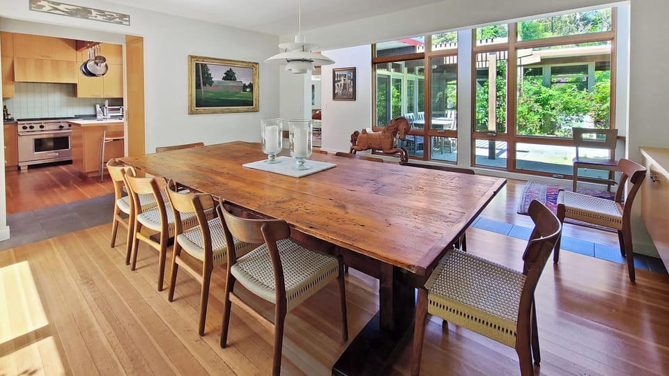 Dining room with large dining table off kitchen