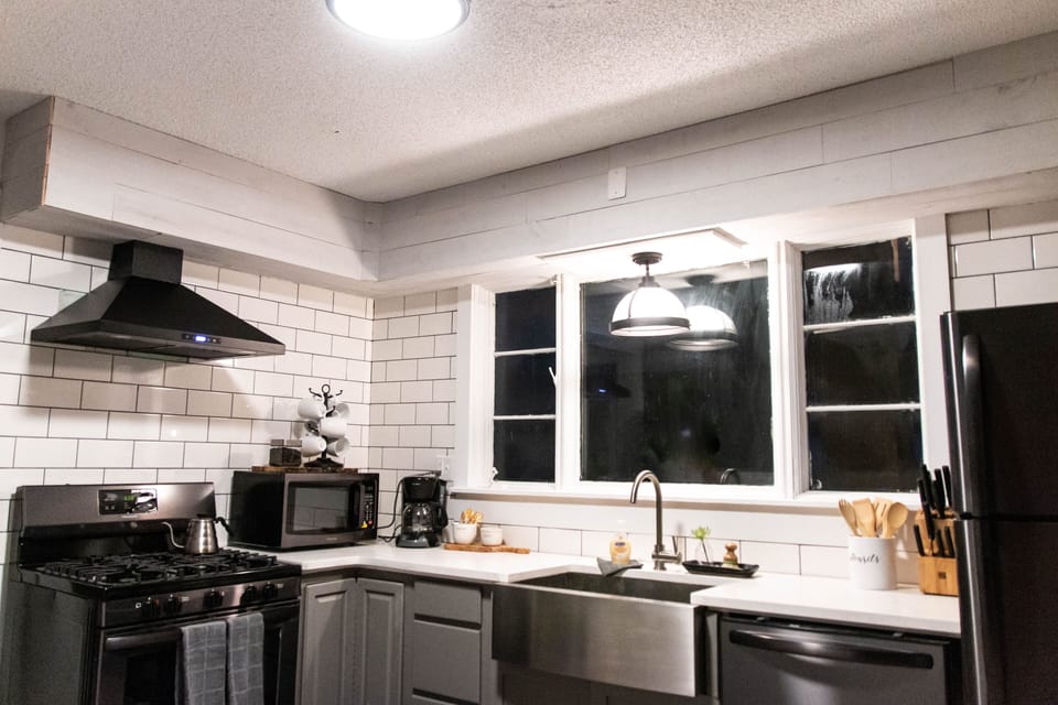 Kitchen has brand new appliances: stove, oven, microwave, fridge & dishwasher.