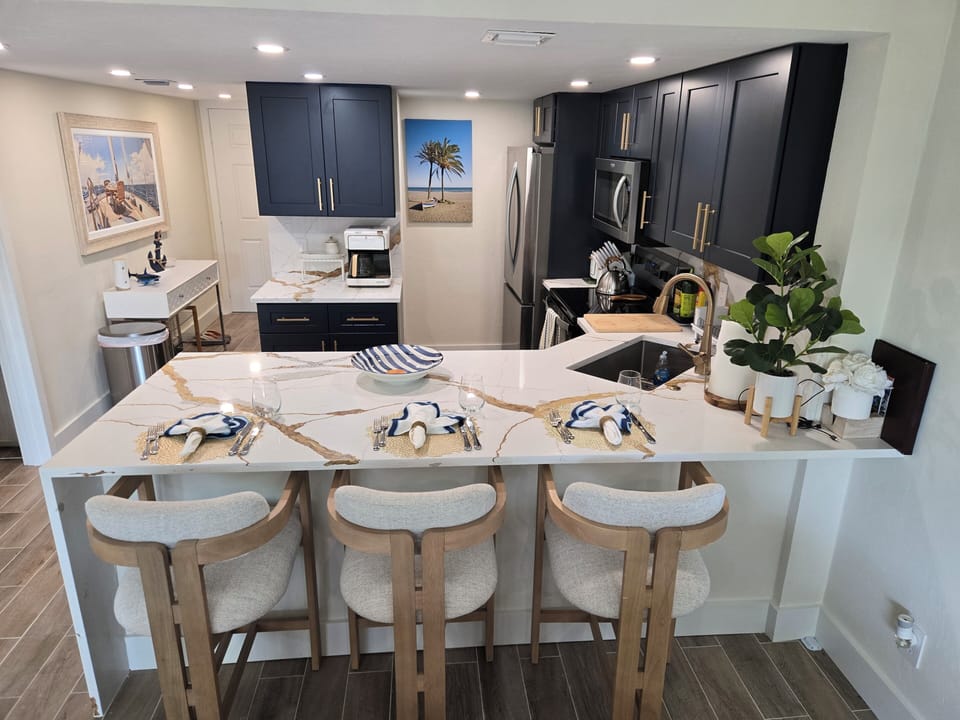 kitchen with three bar stools for breakfast lunch or dinner