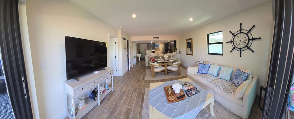 the living room overlooking the dining area and the kitchen