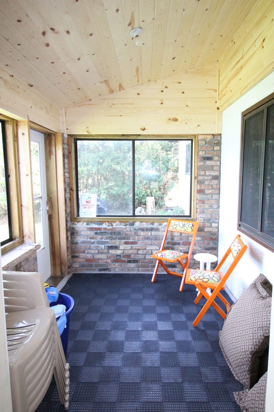 sunroom off living room with lake views