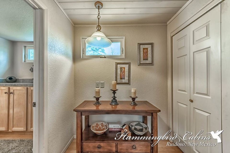Entry way leading to laundry room and main level bathroom