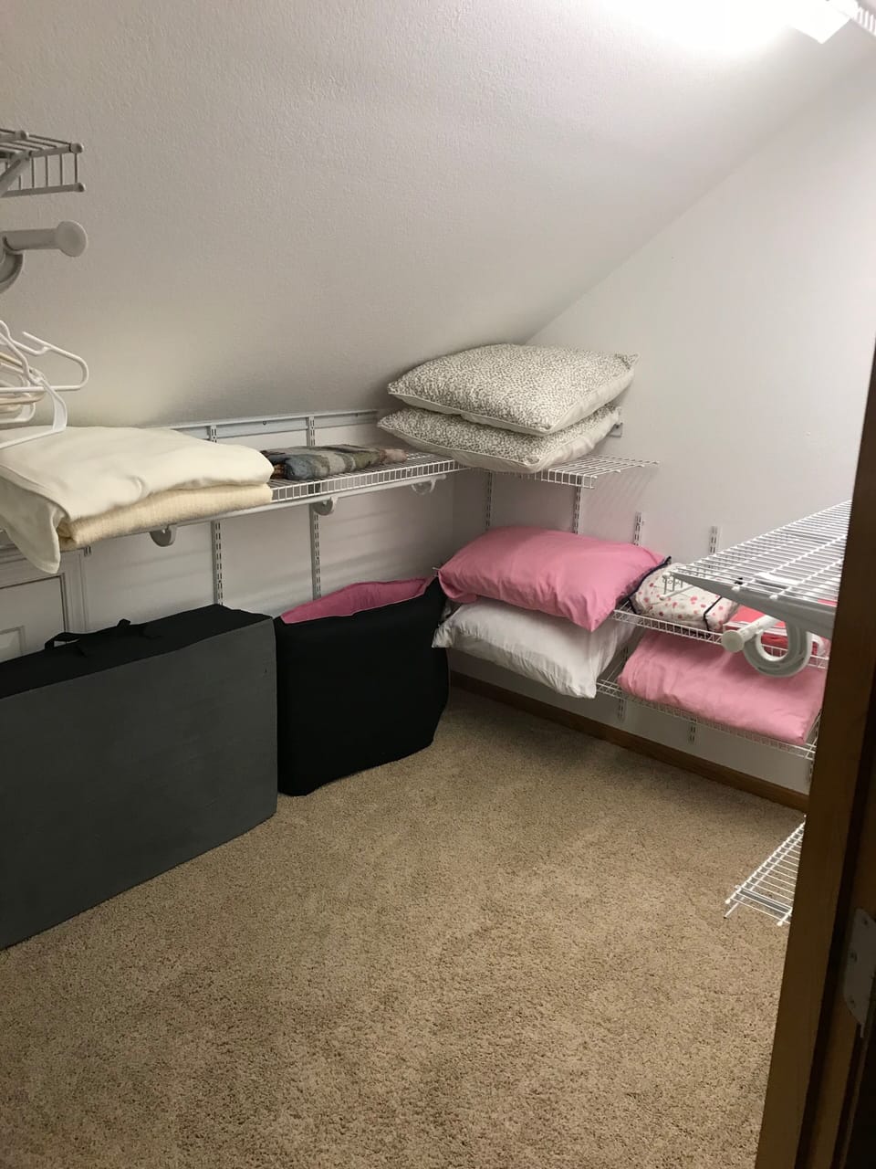 Master closet has 2 cots and bedding! Plus a box fan for fan sleepers 
