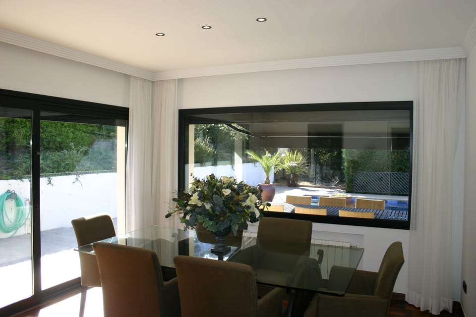 Dining room with view over terrace and pool
