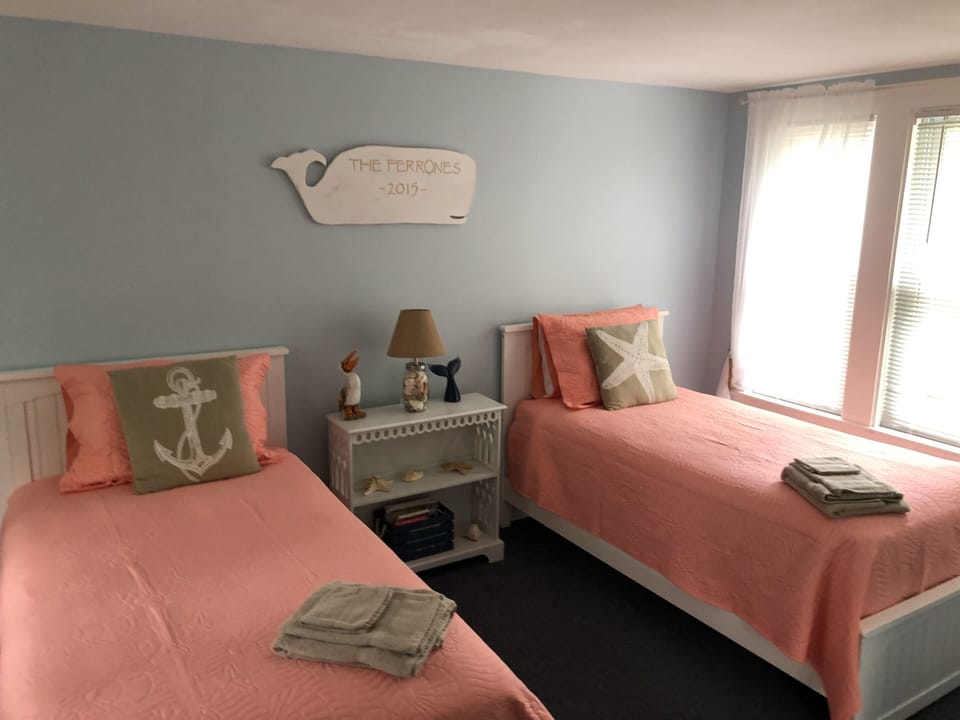 New Twin Beds with all new bed linens, AC & a bureau