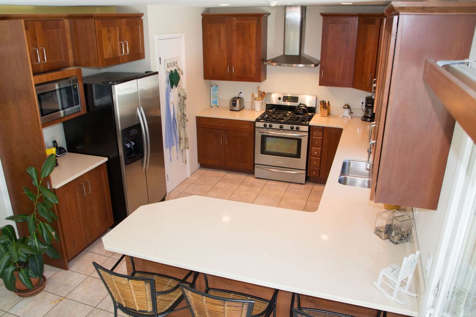 The spacious eat-in kitchen will surely be a popular gathering area.