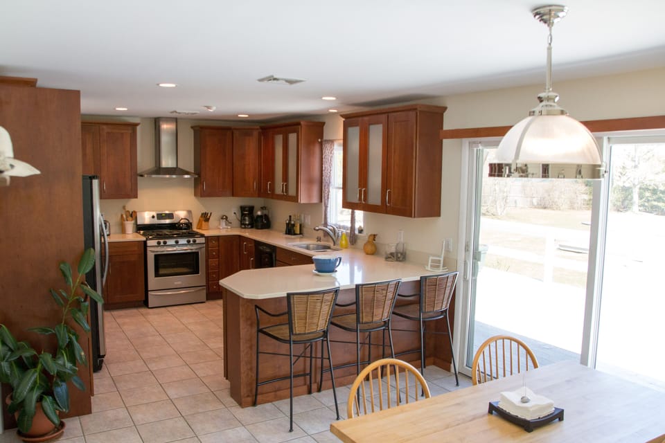 The kitchen features Silestone Countertops and a lovely breakfast bar.