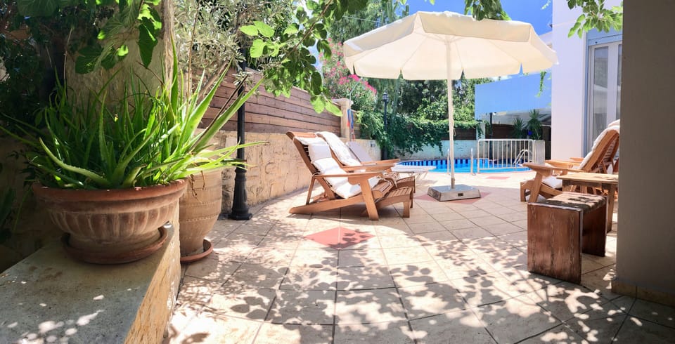 Sun loungers on the villa’s private pool area