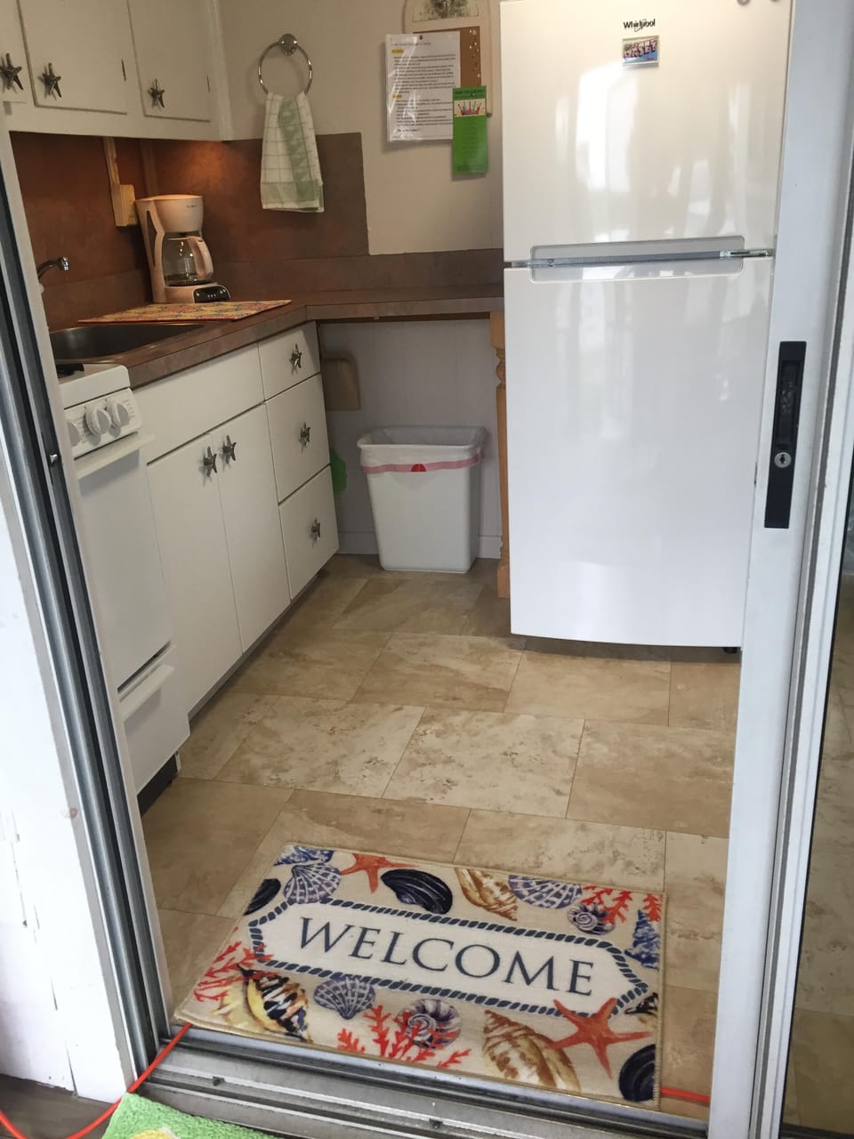 coming into the kitchen from the screened porch