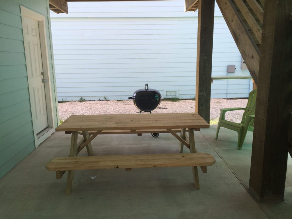 BBQ area with picnic table and half bathroom
