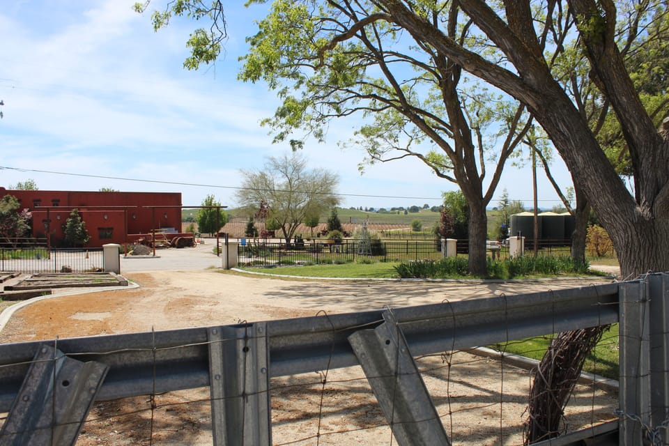 View from inside gate towards vineyards, dedicated parking area for 2 vehicles