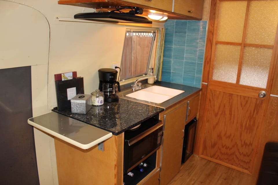 Sparkling water, coffee maker with coffee, tea, and hot chocolate available
