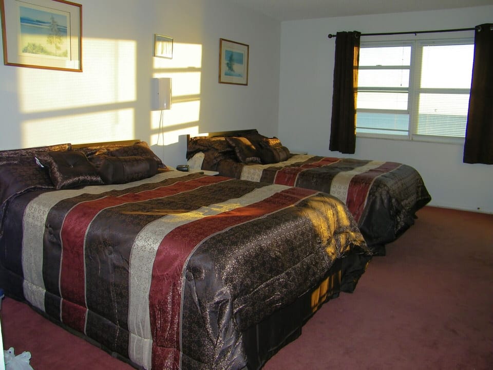 Beachfront bedroom with Queen and Double beds