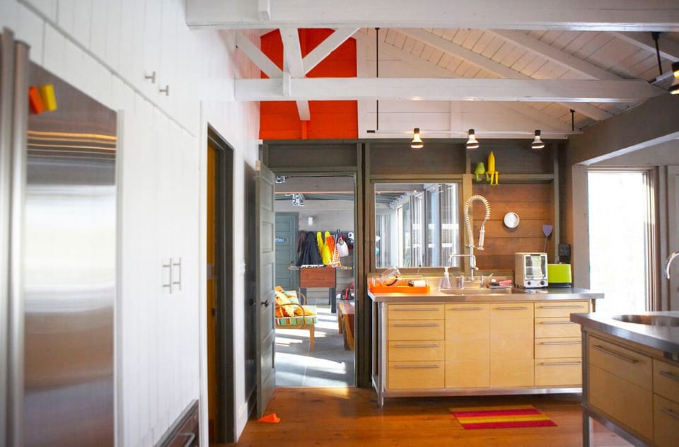 The open Kitchen leading into Sunroom