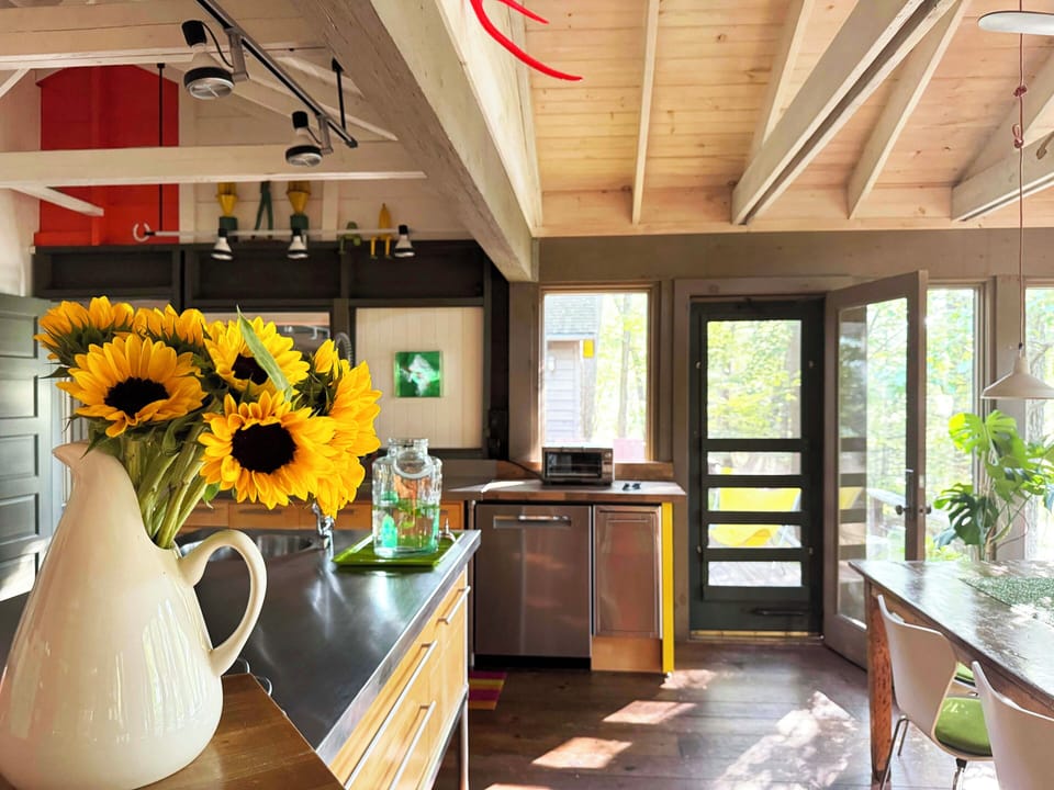 Bright, modern kitchen with open layout and living room view—great for hosting.