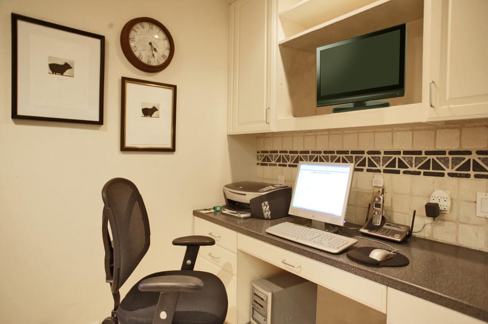 Office area in kitchen with broadband access computer, wireless and fax