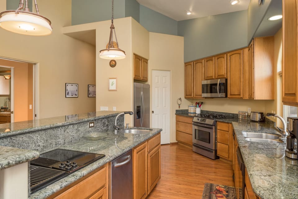 Kitchen with granite counter top. 
