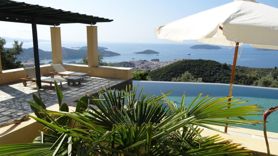 Pool-side pergola offers shelter from the sun for a nap or to enjoy your book