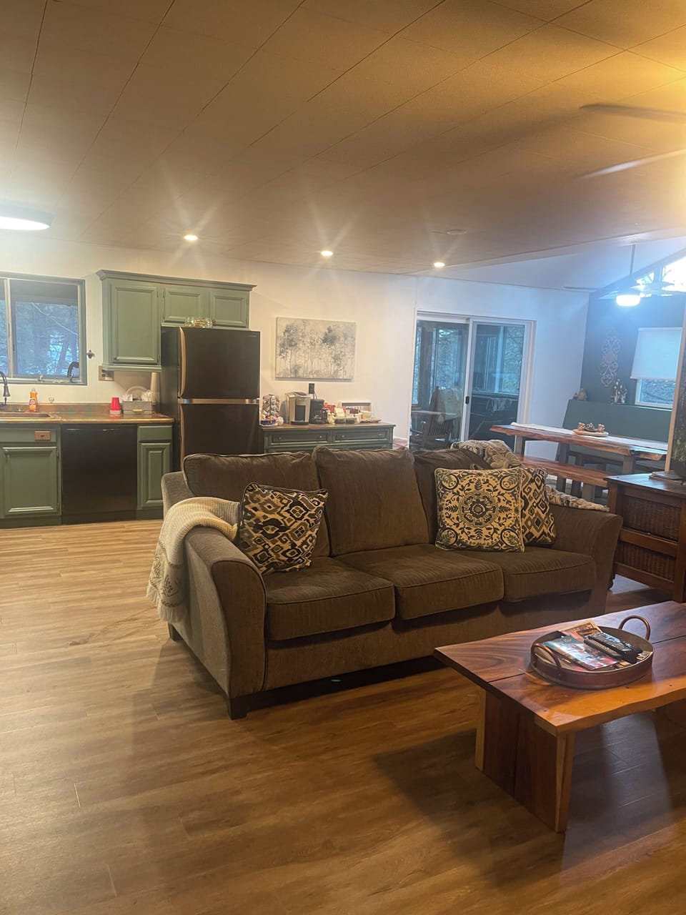 Large family room & kitchen area. Home has everything you need to make meals. 