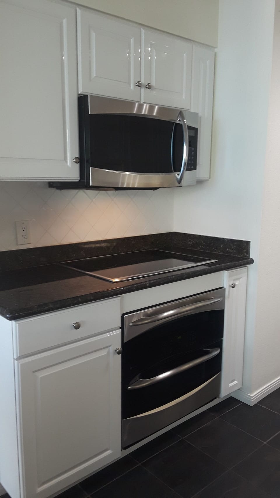 GE Profile Double oven, cooktop, and microwave.