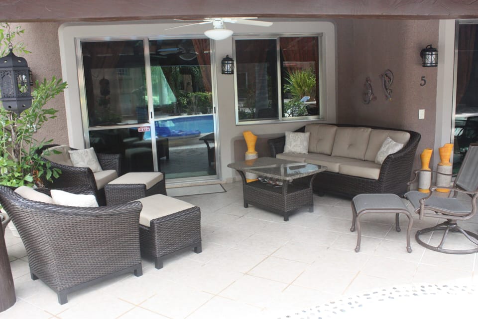 relax on comfort furniture on covered patio