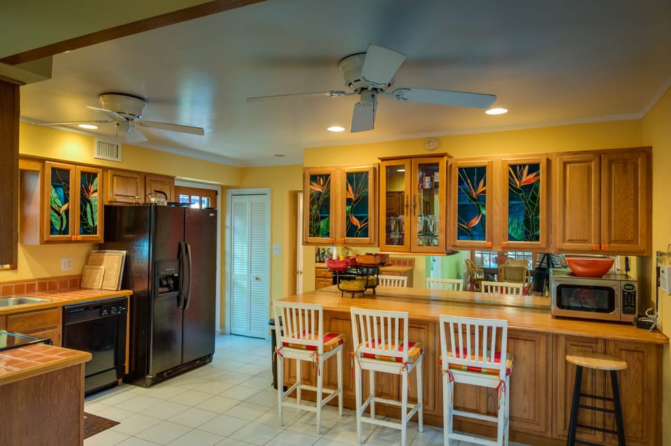 The colorful Key West kitchen is fully stocked has all the modern conveniences.