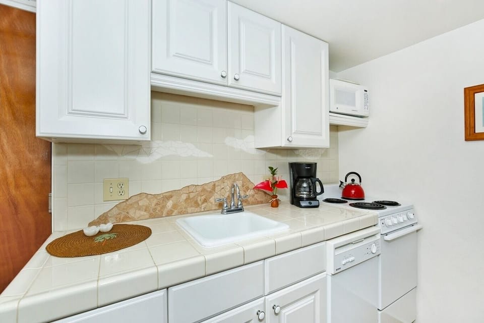 Full kitchen with essentials for  cooking.